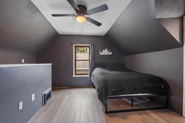 1418 W Washington St, Appleton, WI 54914 - bedroom featuring wood finished floors, vaulted ceiling, and a ceiling fan