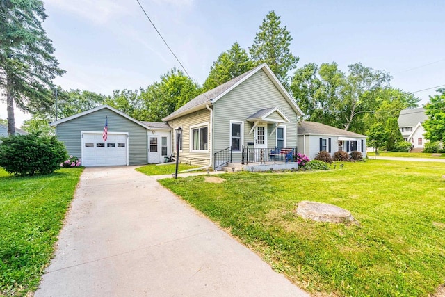 1329 Central St, Oshkosh, WI 54901 - ranch-style home with concrete driveway, a front yard, and a garage