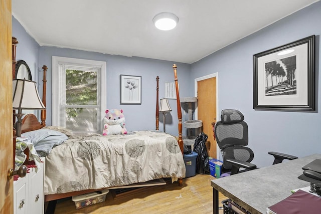1329 Central St, Oshkosh, WI 54901 - bedroom featuring wood finished floors and a desk