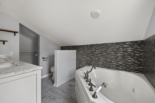 513 61st St, Kenosha, WI 53143 - bathroom with vaulted ceiling, double vanity, and a tub with jets