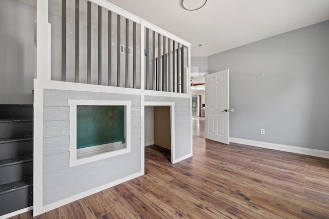 513 61st St, Kenosha, WI 53143 - unfurnished bedroom with baseboards and wood finished floors