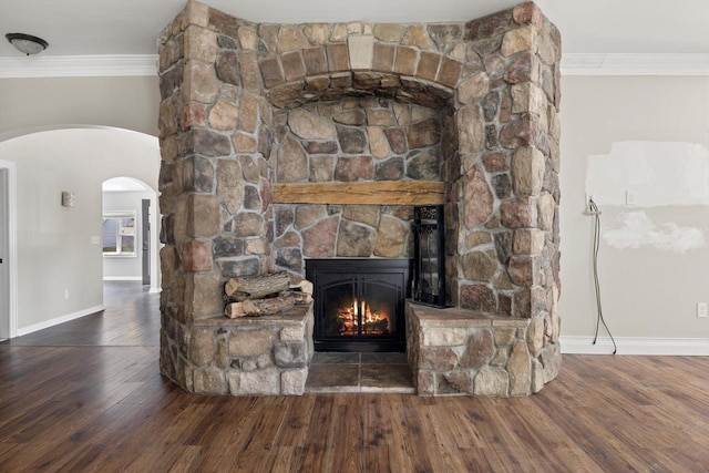 513 61st St, Kenosha, WI 53143 - detailed view of arched walkways, ornamental molding, wood finished floors, and a stone fireplace