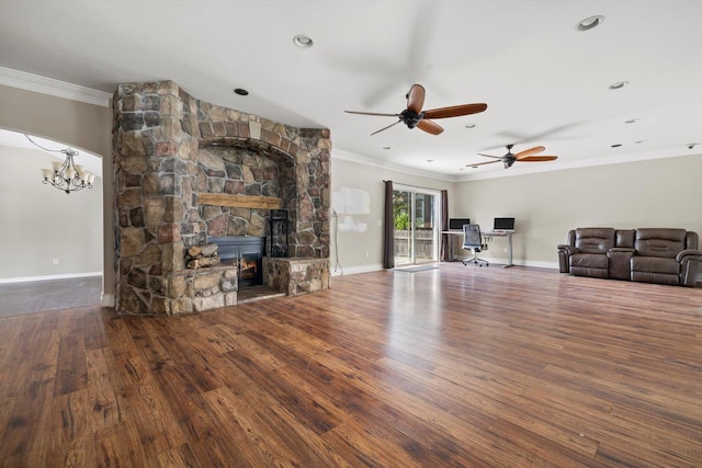 513 61st St, Kenosha, WI 53143 - unfurnished living room with ornamental molding, ceiling fan, wood finished floors, a fireplace, and a chandelier