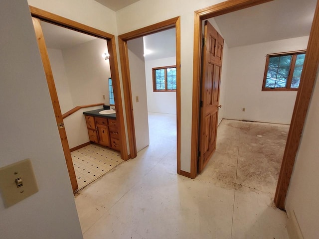 1607 E Cleveland St, Marshfield, WI 54449 - hallway featuring a sink and baseboards