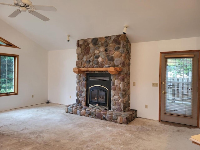 1607 E Cleveland St, Marshfield, WI 54449 - unfurnished living room featuring lofted ceiling, carpet floors, a stone fireplace, and ceiling fan