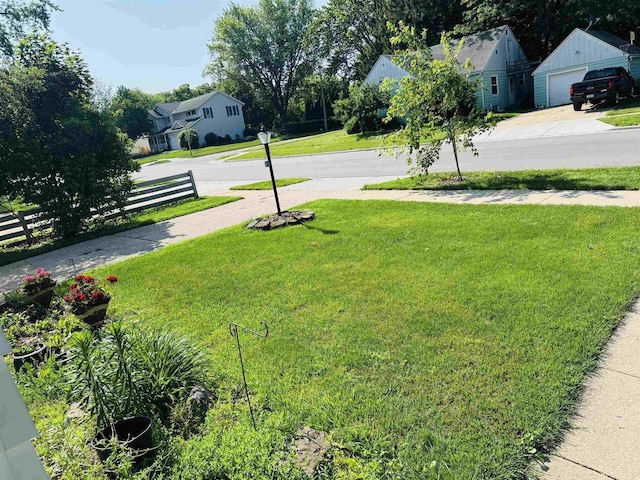 1117 21st St, Monroe, WI 53566 - view of yard with a residential view and a garage