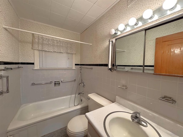 1117 21st St, Monroe, WI 53566 - bathroom featuring tile walls, vanity, wallpapered walls, wainscoting, and shower / tub combination