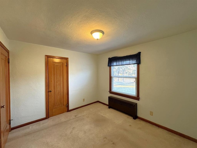 1117 21st St, Monroe, WI 53566 - spare room featuring light carpet and a textured ceiling