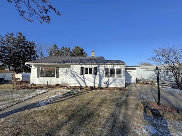 1117 21st St, Monroe, WI 53566 - single story home featuring a chimney and a metal roof