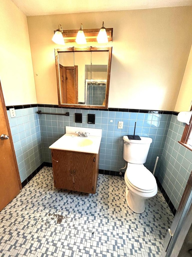 4228 N 52nd St, Milwaukee, WI 53216 - bathroom featuring wainscoting, vanity, and tile walls