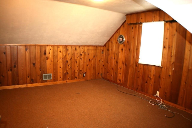 4228 N 52nd St, Milwaukee, WI 53216 - bonus room with vaulted ceiling, wooden walls, and carpet