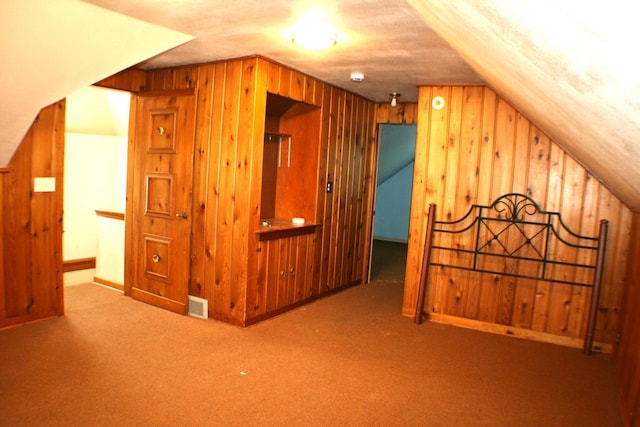 4228 N 52nd St, Milwaukee, WI 53216 - additional living space featuring wood walls, carpet, and vaulted ceiling