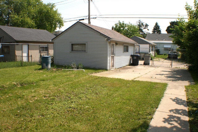 4228 N 52nd St, Milwaukee, WI 53216 - back of house featuring a gate, roof with shingles, and a patio