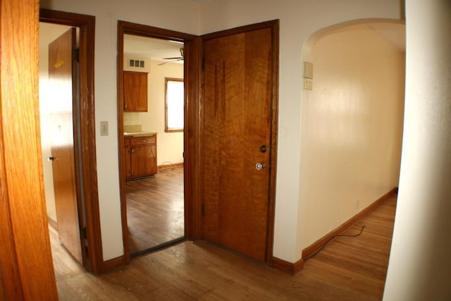 4228 N 52nd St, Milwaukee, WI 53216 - corridor featuring arched walkways and light wood-style flooring