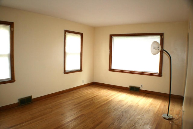 4228 N 52nd St, Milwaukee, WI 53216 - unfurnished room featuring healthy amount of natural light and wood finished floors