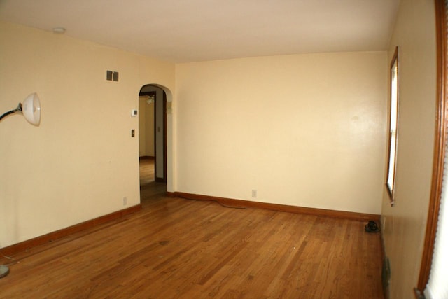 4228 N 52nd St, Milwaukee, WI 53216 - unfurnished room with arched walkways and wood finished floors