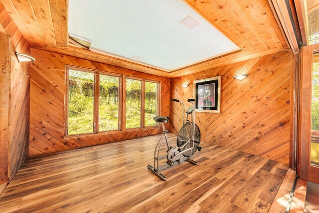 W296N2978 Franciscan Rd, Pewaukee, WI 53072 - exercise room featuring wooden walls and wood finished floors