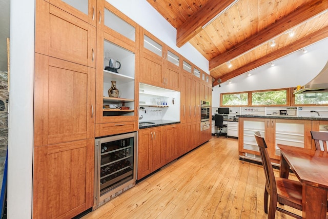 W296N2978 Franciscan Rd, Pewaukee, WI 53072 - kitchen with beverage cooler, light wood-style flooring, stainless steel oven, glass insert cabinets, and wooden ceiling