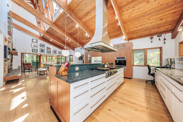 W296N2978 Franciscan Rd, Pewaukee, WI 53072 - kitchen with stainless steel appliances, island exhaust hood, light wood-style flooring, high vaulted ceiling, and a chandelier