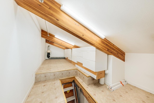 W296N2978 Franciscan Rd, Pewaukee, WI 53072 - additional living space featuring lofted ceiling and baseboards