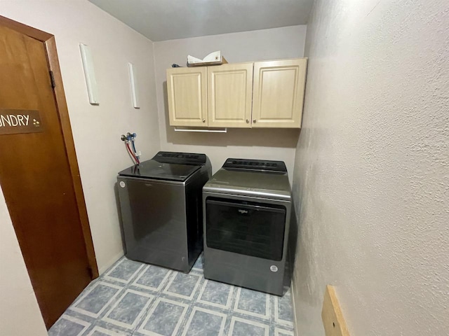 1116 Liberty Ave, Beloit, WI 53511 - laundry room with cabinet space, washer and clothes dryer, and light floors