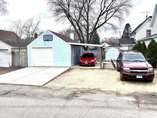 1116 Liberty Ave, Beloit, WI 53511 - garage featuring a garage, a shed, and concrete driveway