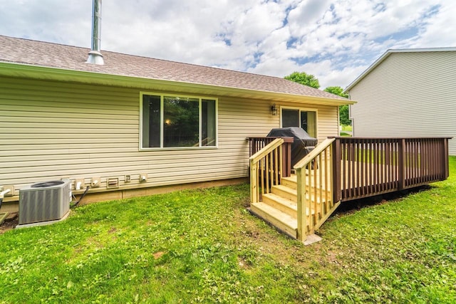 6615 Cavin Dr, Wausau, WI 54401 - back of house with a wooden deck and a yard