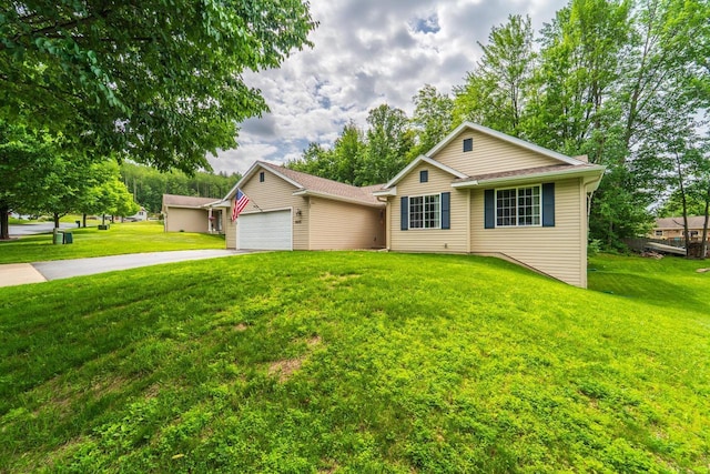 6615 Cavin Dr, Wausau, WI 54401 - view of front of house featuring driveway, an attached garage, a front lawn, and an outbuilding