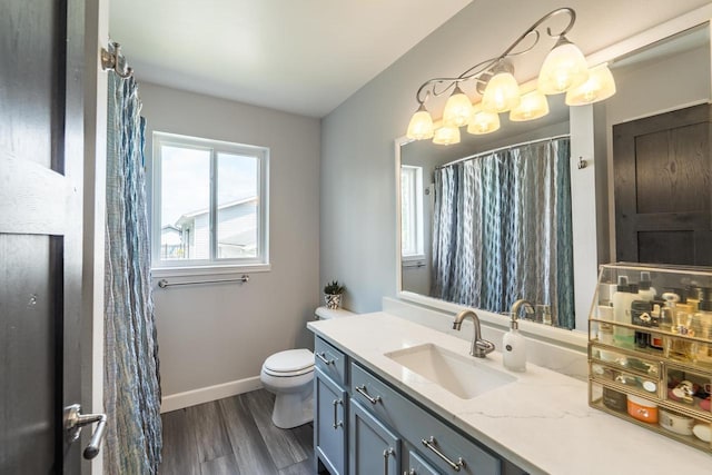 6615 Cavin Dr, Wausau, WI 54401 - full bathroom with vanity and wood finished floors