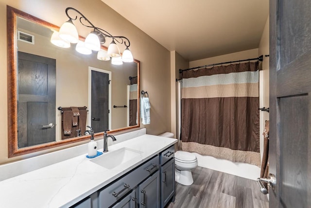 6615 Cavin Dr, Wausau, WI 54401 - full bath featuring vanity, wood finished floors, and shower / bathtub combination with curtain