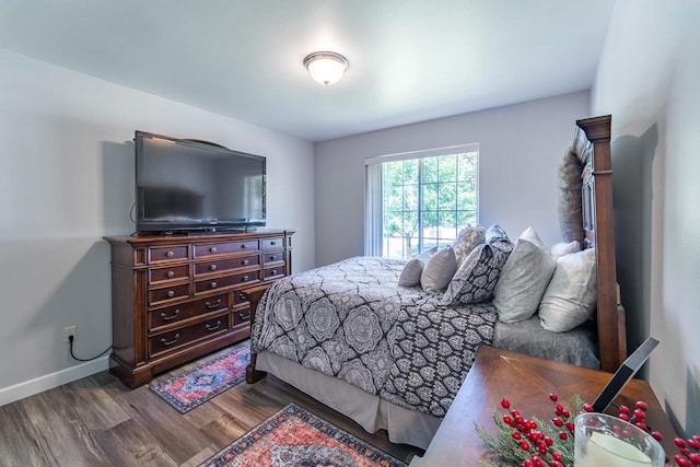 6615 Cavin Dr, Wausau, WI 54401 - bedroom featuring wood finished floors and baseboards