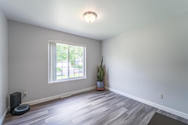 6615 Cavin Dr, Wausau, WI 54401 - spare room featuring wood finished floors and baseboards