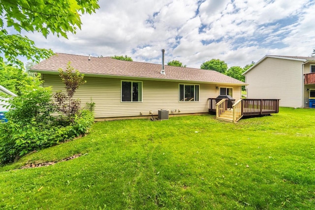6615 Cavin Dr, Wausau, WI 54401 - rear view of property with a wooden deck and a yard