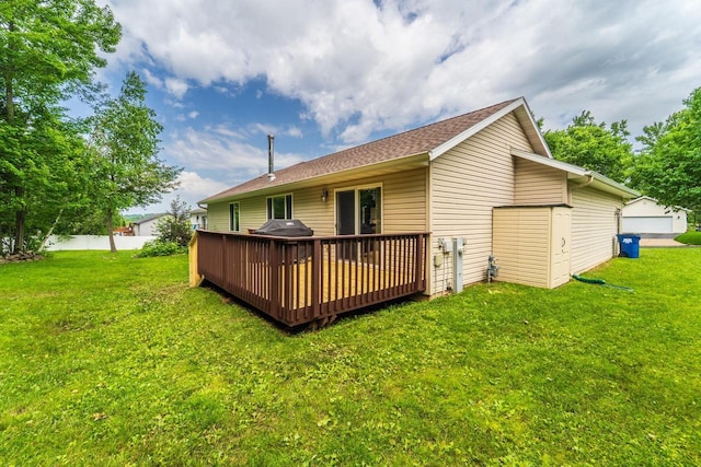 6615 Cavin Dr, Wausau, WI 54401 - rear view of property with a deck and a lawn
