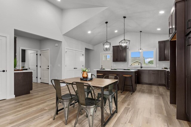 3453 Veanna Blvd, Oshkosh, WI 54904 - dining room with light wood-style flooring, recessed lighting, a chandelier, and high vaulted ceiling