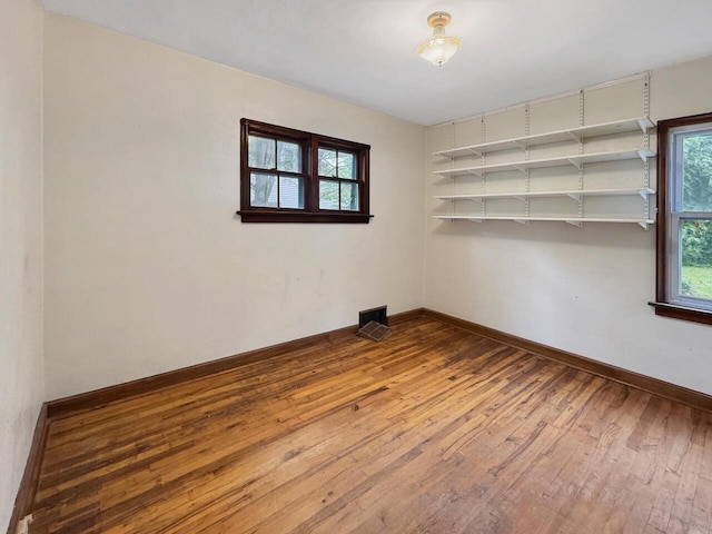 4958 S 20th St, Milwaukee, WI 53221 - empty room with wood-type flooring and baseboards
