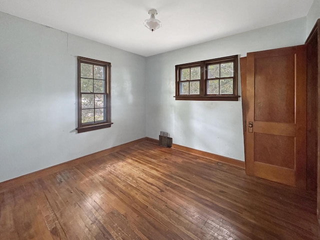 4958 S 20th St, Milwaukee, WI 53221 - empty room featuring plenty of natural light and wood-type flooring
