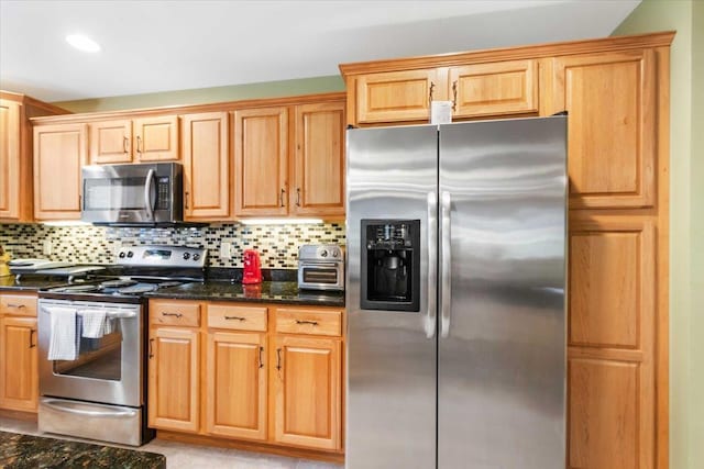 1844-3 E 20th Ct Unit 2503, Arkdale, WI 54613 - kitchen with stainless steel appliances, tasteful backsplash, and dark stone countertops