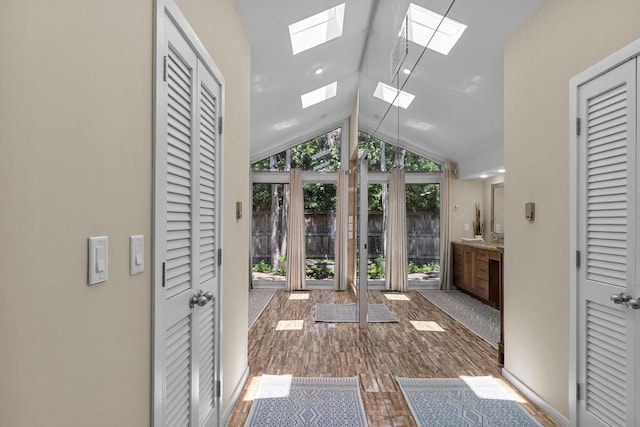 1824 W Reid Dr, Appleton, WI 54914 - doorway featuring lofted ceiling, wood finished floors, and a skylight