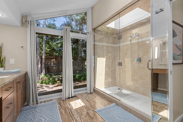 1824 W Reid Dr, Appleton, WI 54914 - bathroom with vanity, a shower stall, and wood finished floors