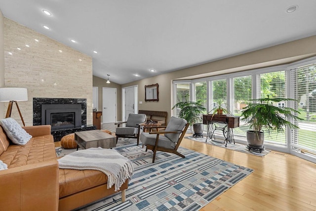 1824 W Reid Dr, Appleton, WI 54914 - living room featuring vaulted ceiling, plenty of natural light, a premium fireplace, wood-type flooring, and recessed lighting