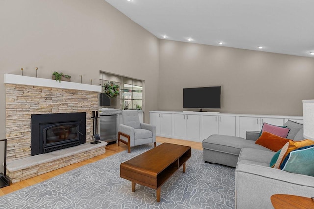 1824 W Reid Dr, Appleton, WI 54914 - living room with wood finished floors, a stone fireplace, recessed lighting, and vaulted ceiling