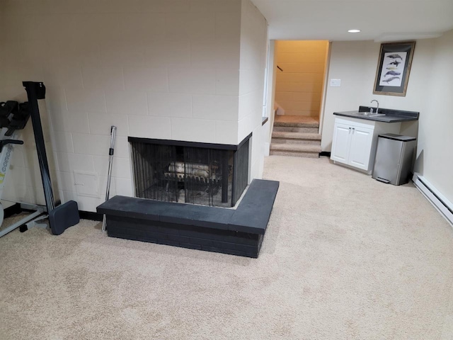 1824 W Reid Dr, Appleton, WI 54914 - living area featuring light carpet, stairs, a multi sided fireplace, and baseboard heating