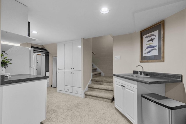 1824 W Reid Dr, Appleton, WI 54914 - kitchen with light colored carpet, white cabinets, recessed lighting, and dark countertops