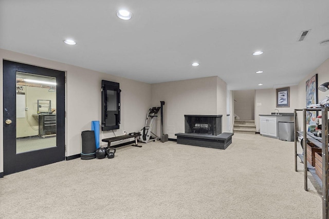 1824 W Reid Dr, Appleton, WI 54914 - workout area with carpet, recessed lighting, and a fireplace with raised hearth