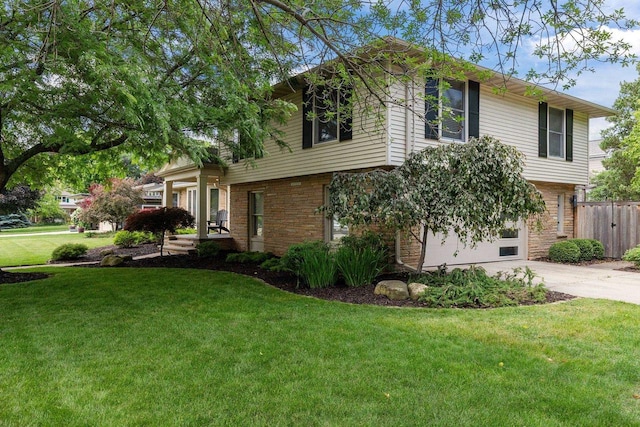 1824 W Reid Dr, Appleton, WI 54914 - view of front of house featuring concrete driveway, a garage, and brick siding