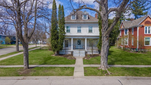 195 E Park Ave, Berlin, WI 54923 - view of front facade with covered porch and a front lawn