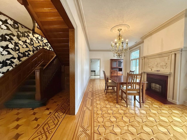 195 E Park Ave, Berlin, WI 54923 - dining room featuring ornamental molding, a chandelier, a fireplace, stairway, and a textured ceiling