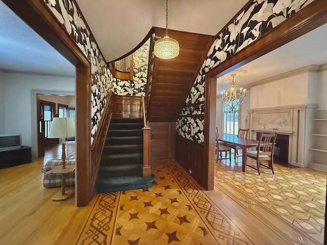195 E Park Ave, Berlin, WI 54923 - stairs with wood finished floors, a chandelier, and lofted ceiling