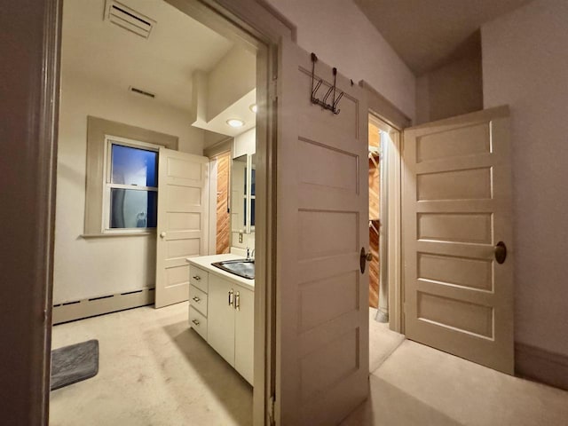 195 E Park Ave, Berlin, WI 54923 - bathroom with a baseboard heating unit and vanity